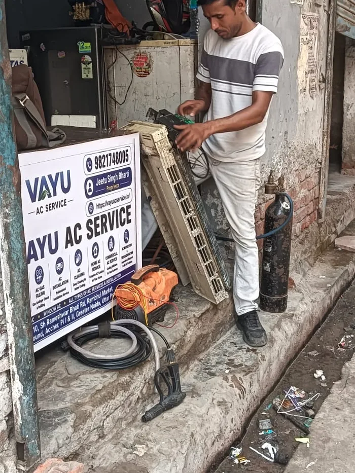 Vayu AC Service technician checking an AC unit in Greater Noida