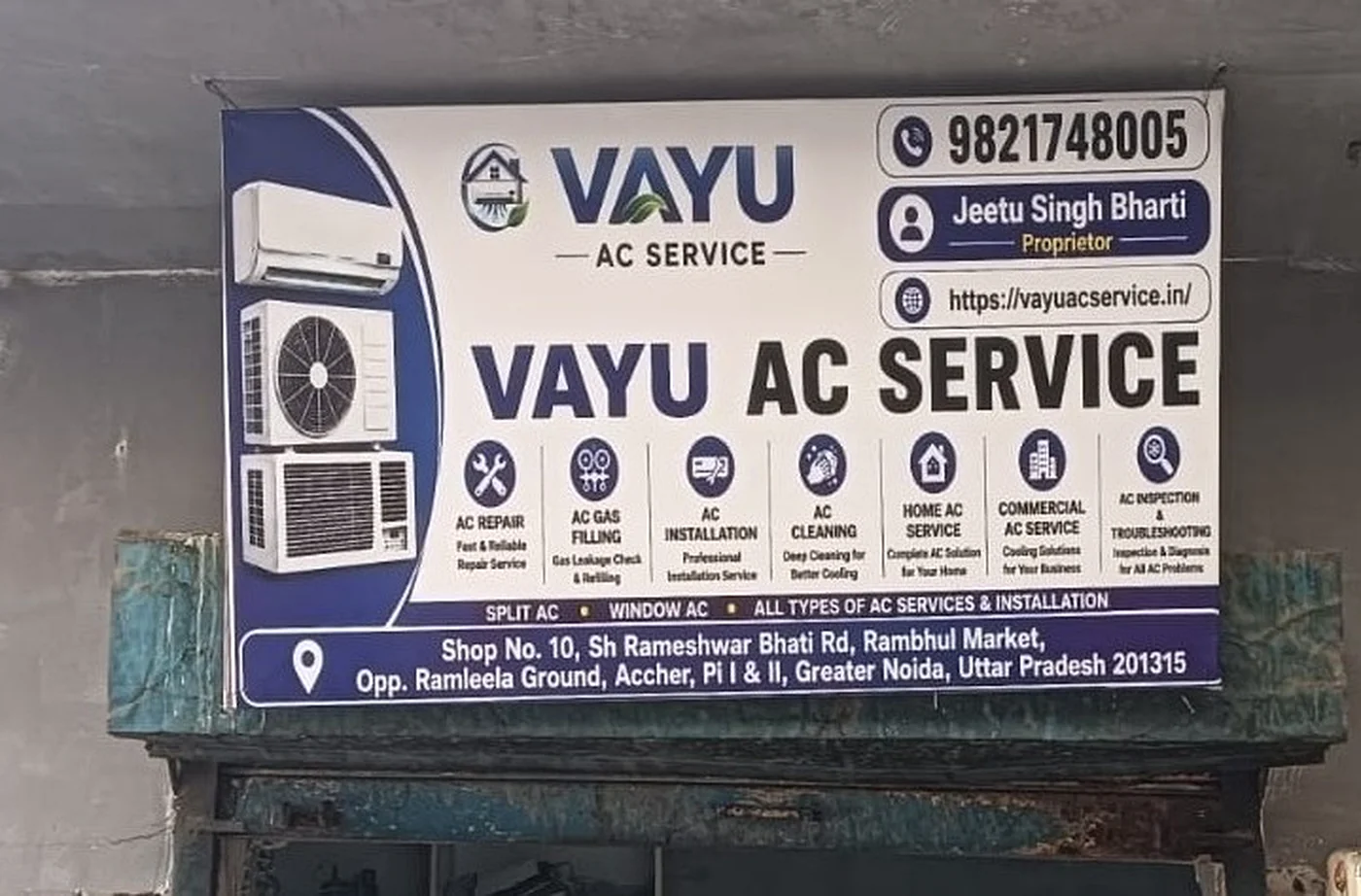 Vayu AC Service sign board showing all services, phone number, and address in Greater Noida