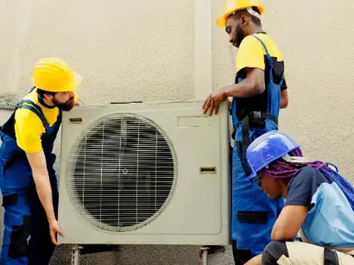 Vayu AC Service technicians handling a commercial outdoor AC unit in Greater Noida